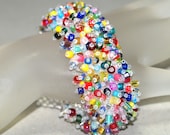 Arm Candy ... Caterpillar Bracelet . Colorful Jewelry . Fringed . Beadwoven . Bold . Multicolor . Festive . Rainbow . Brilliant . Lush