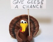 Turkey with sign: Give geese a chance