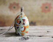Fantasy pebble.  Polymer clay pendant.  Glass like finish. Mokume gane. Earthy colors. Fall colors.