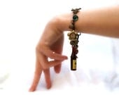 Vintage & Antique Charm Bracelet with Kewpie Doll and Tiny Skeleton Key