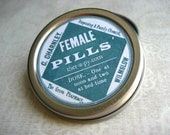 round pill box with vintage female pills phamaceutical label