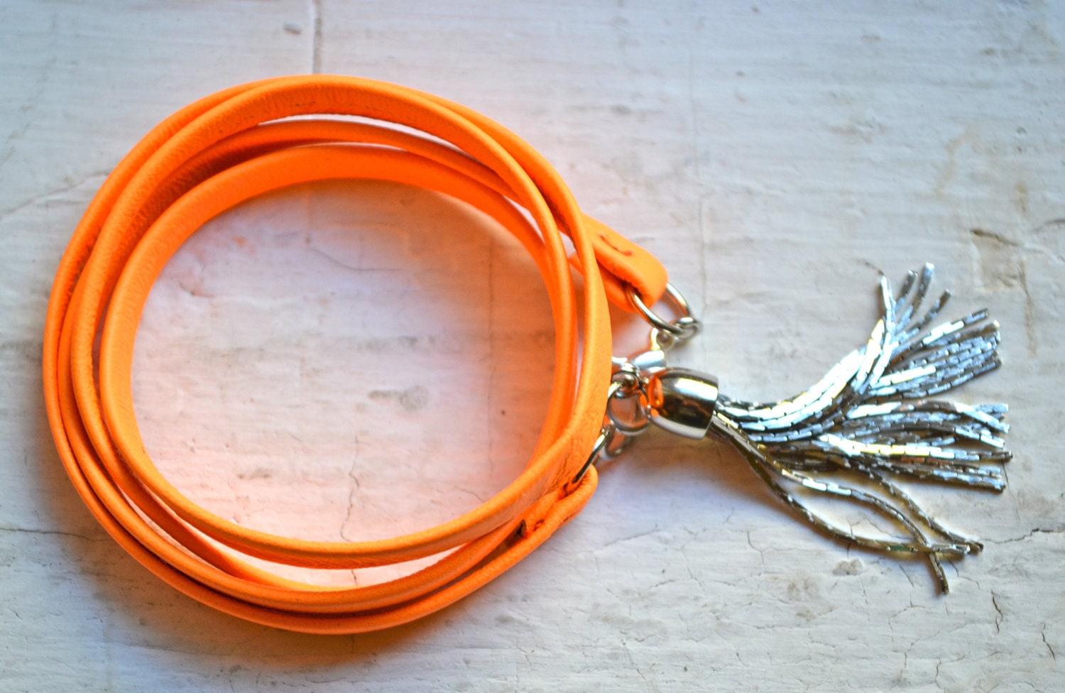 neon orange genuine leather & gold triple wrap bracelet with silver tassel