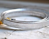 metallic silver genuine leather triple wrap bracelet with gold tassel