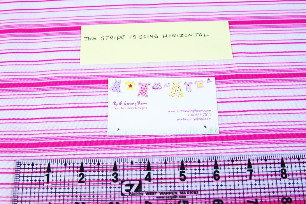 White with multiple Pink Stripes Knit Fabric,  60" Wide, Nylon/Lycra Jersey light-med weight One Yard