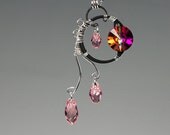 Orthosie v2: Beautiful wire wrapped necklace with cathedral and light rose Swarovski crystals