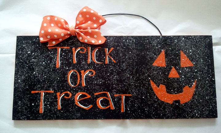 Halloween sign. Trick or Treat with glitter.