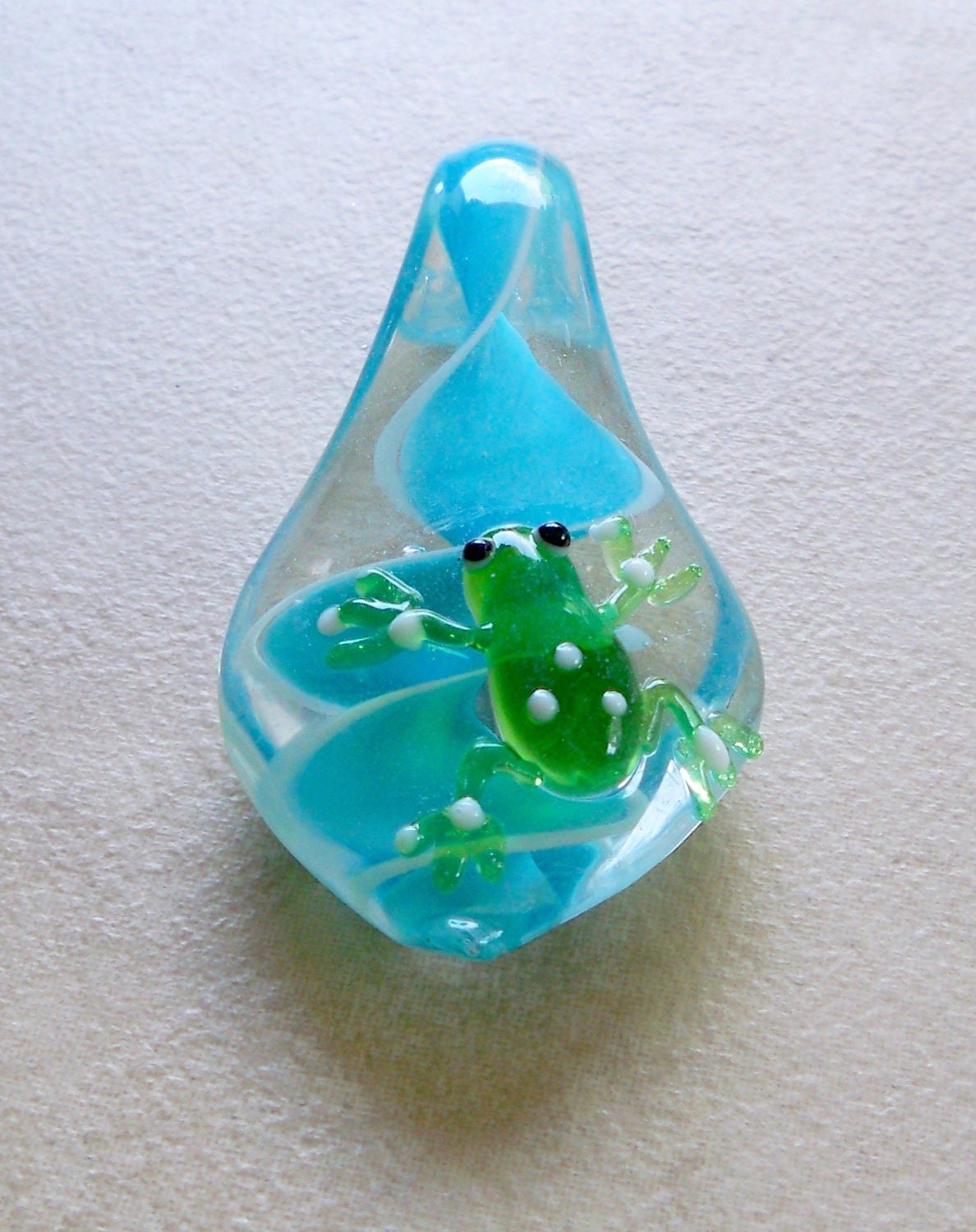 Fun Lampwork pendant with beach frog climbing the turquoise swirl