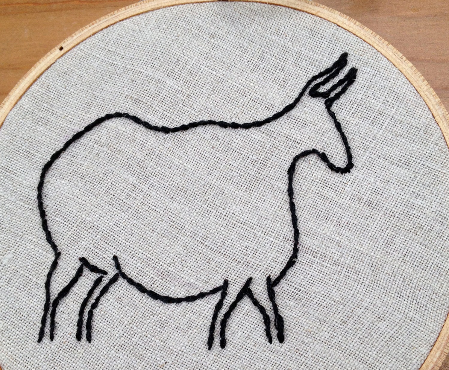 cave-drawing inspired steer hand embroidered wall art