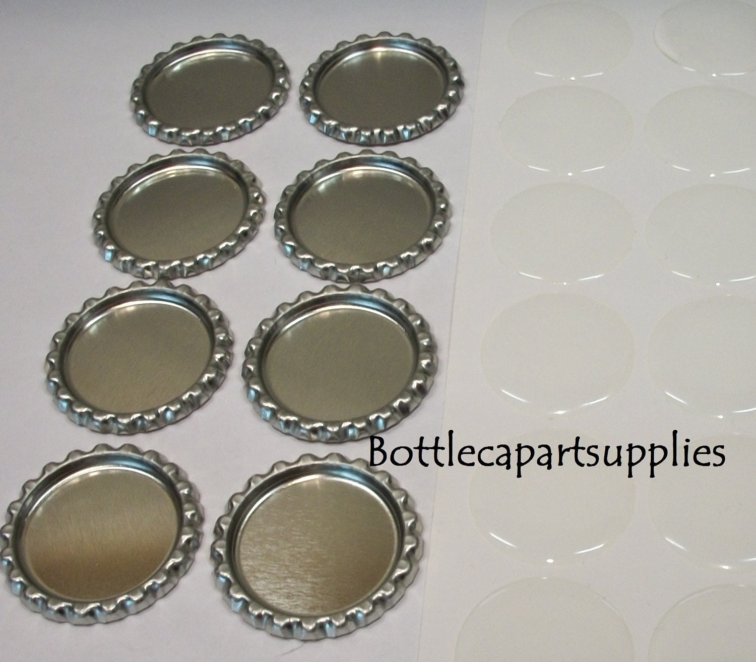 200  pcs. FLAT SILVER  Linerless Bottle Caps and 200 pcs. 1" Epoxy Resin Bottle Cap Seal Sticker Kit.