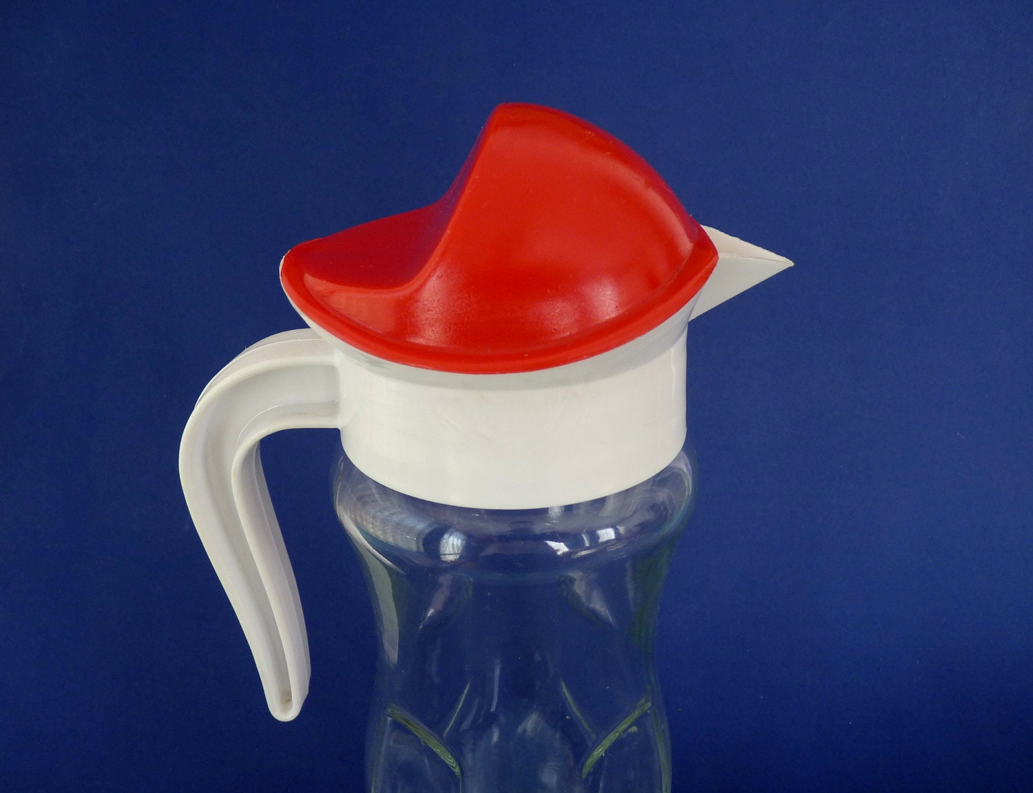 Vintage Mid Century Glass Pitcher With Red and White Plastic Lid.