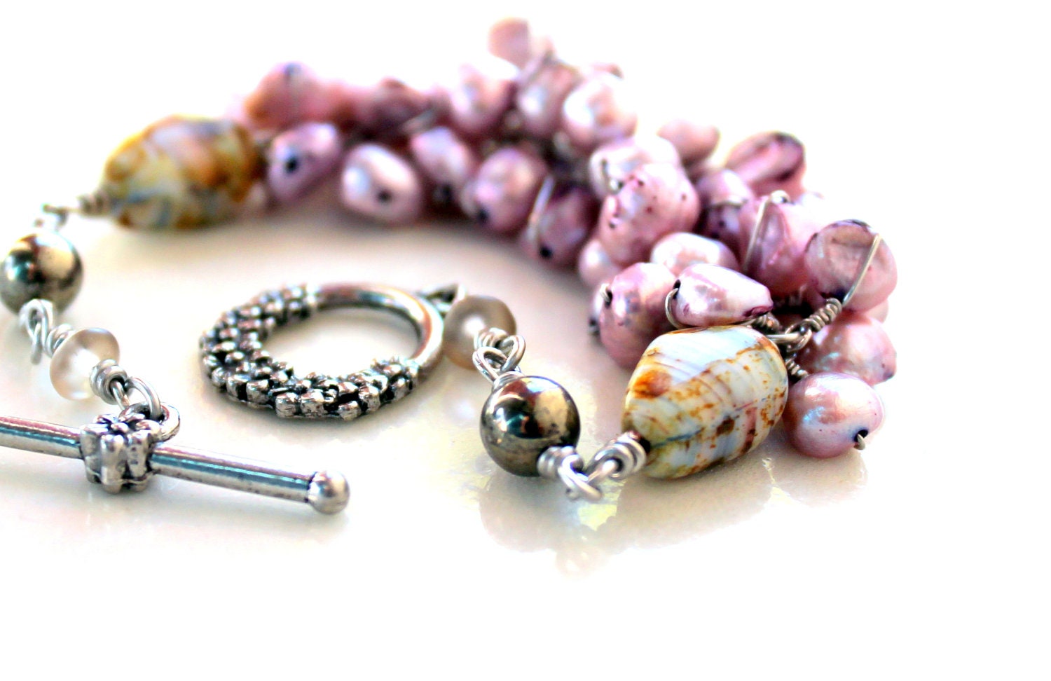 The lilac flower bracelet. edgy pearl wrapped bridal bracelet. pyrite, czech glass, soft purple pearls. flower clasp