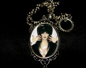 Evil old elviraa haunted pendant