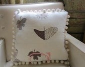 Retro fabric pillow with pom pom trim