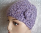Ladies hand knitted hat with flower.