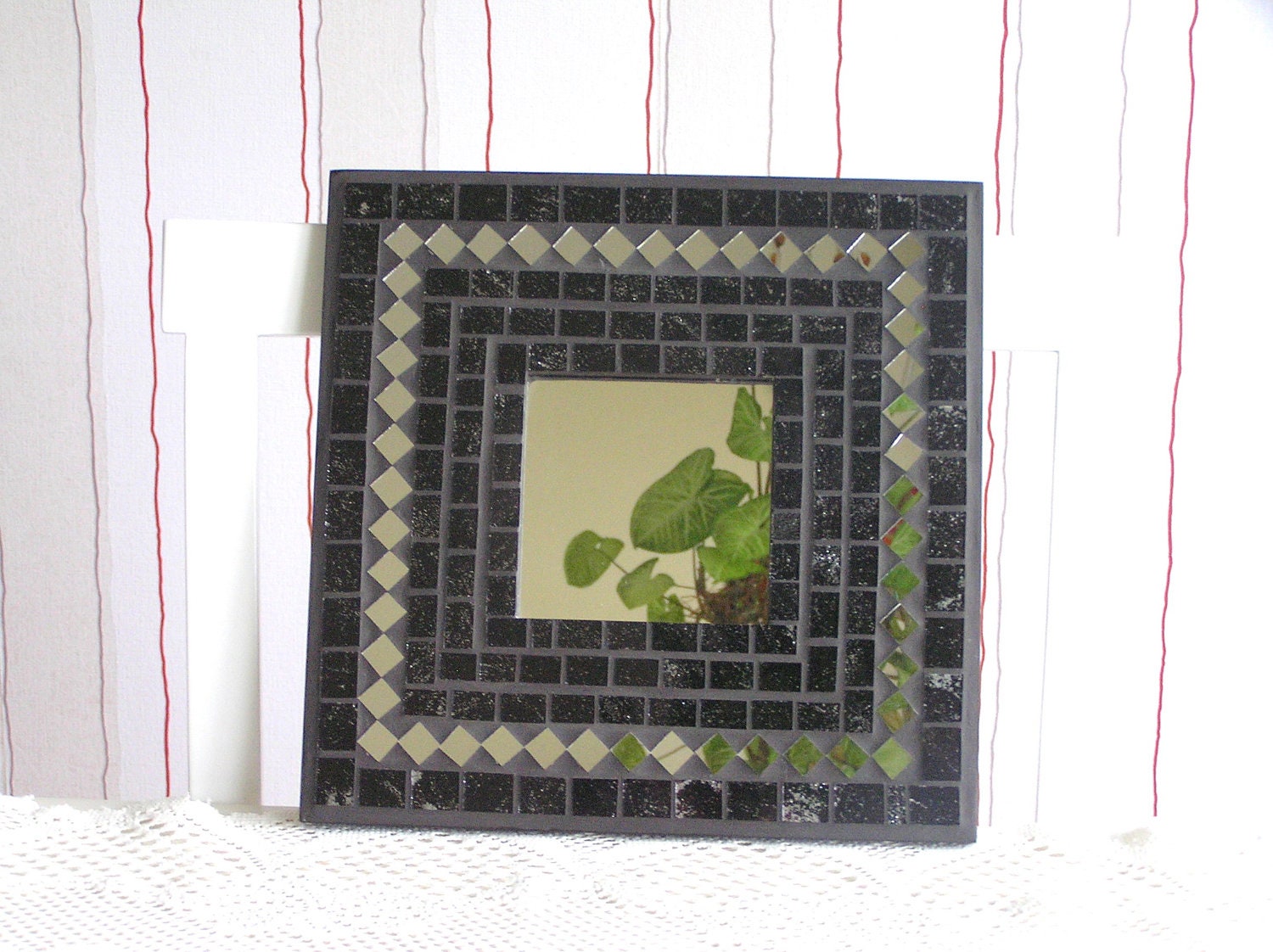 Wall mirror black angular glass mosaic decorated with pieces of mirror