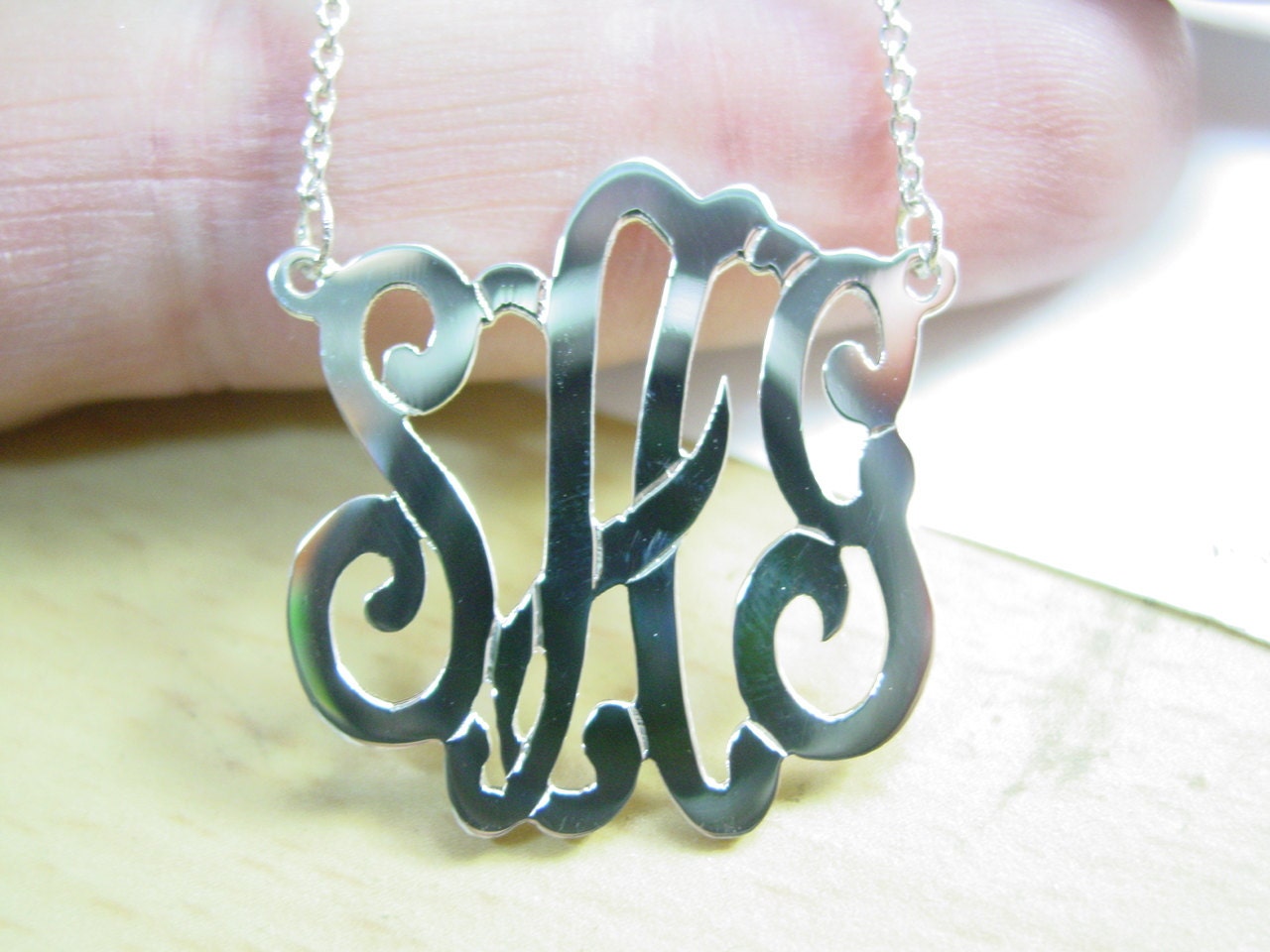 monogram necklace. 1'' size personalized -sterling silver monogram. with a chain.