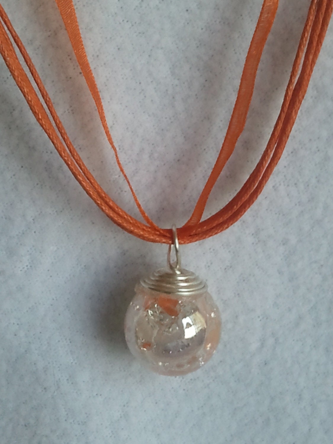 Fried Glass orange swirl  Marble on an orange ribbon Necklace