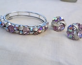 Signed Lisner 1940s Pink aurora borealis hinge bracelet and screw back earrings
