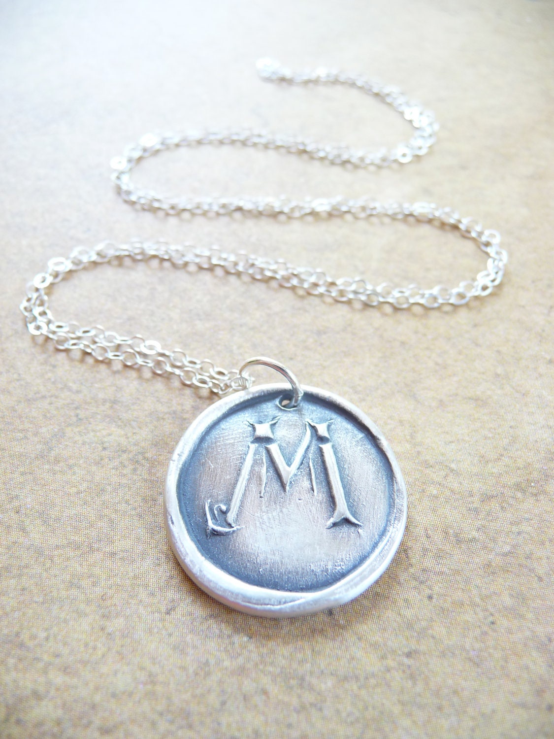Personalized wax seal necklace pendant in letter M, made with recycled fine silver by Dream of a Dream