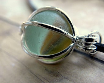 Blue sea glass marble pendant in a silver locket
