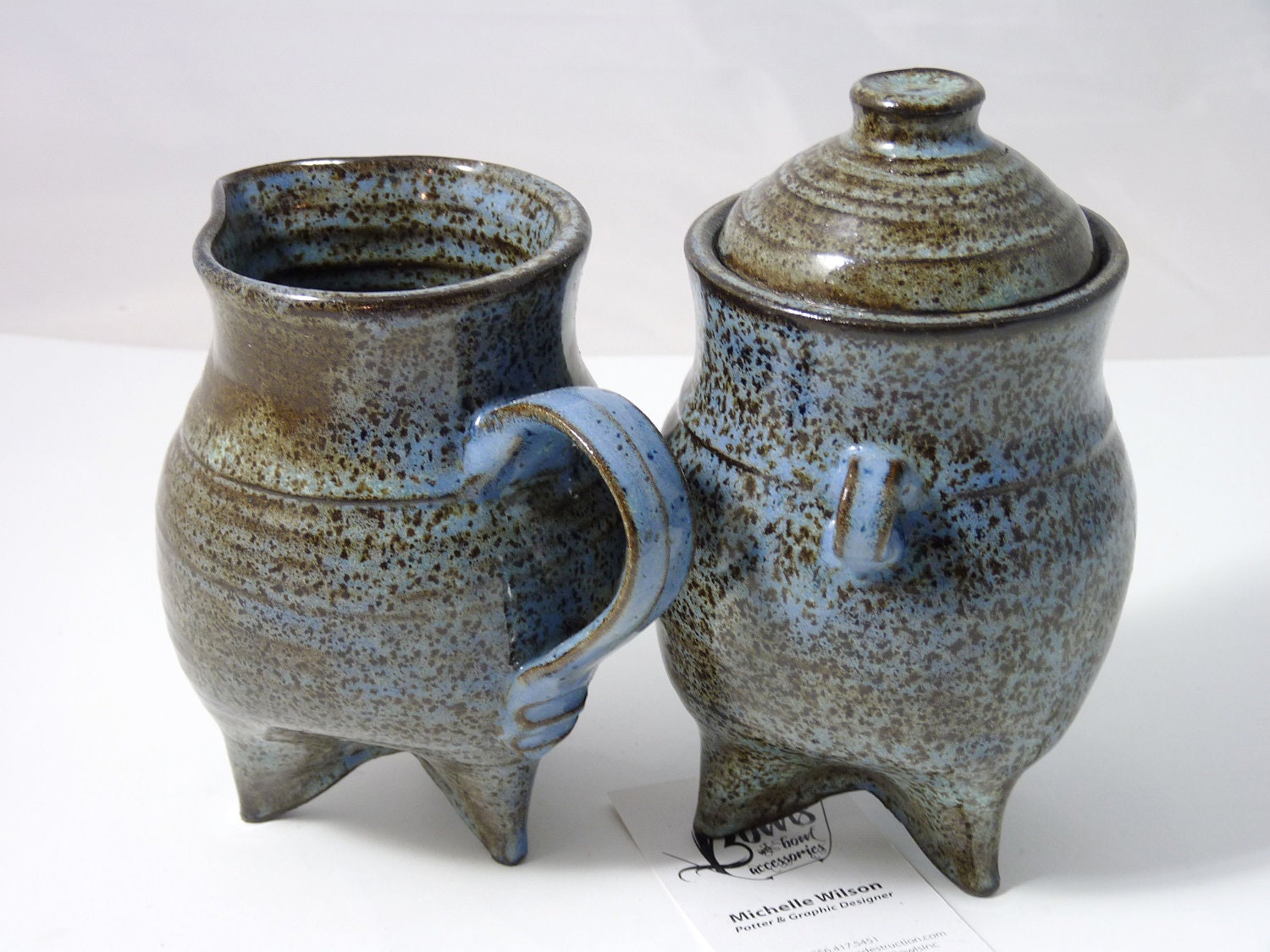 Tripod footed Sugar and Creamer set glazed in speckled blue