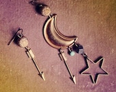 wanderlust.  a pair of celestial moon and star assymetrical earrings.