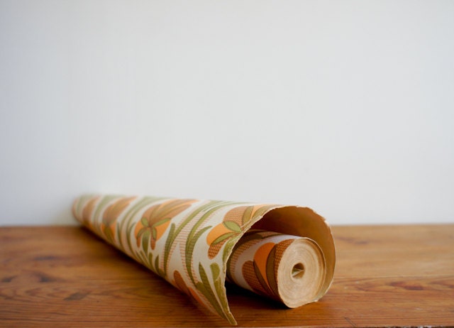 1970's french wallpaper with geometric flower design in greens, browns and orange, full roll