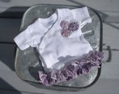 White Cross Over Snapping T-Shirt with Vintage Looking Purple Rosettes and Ruffle