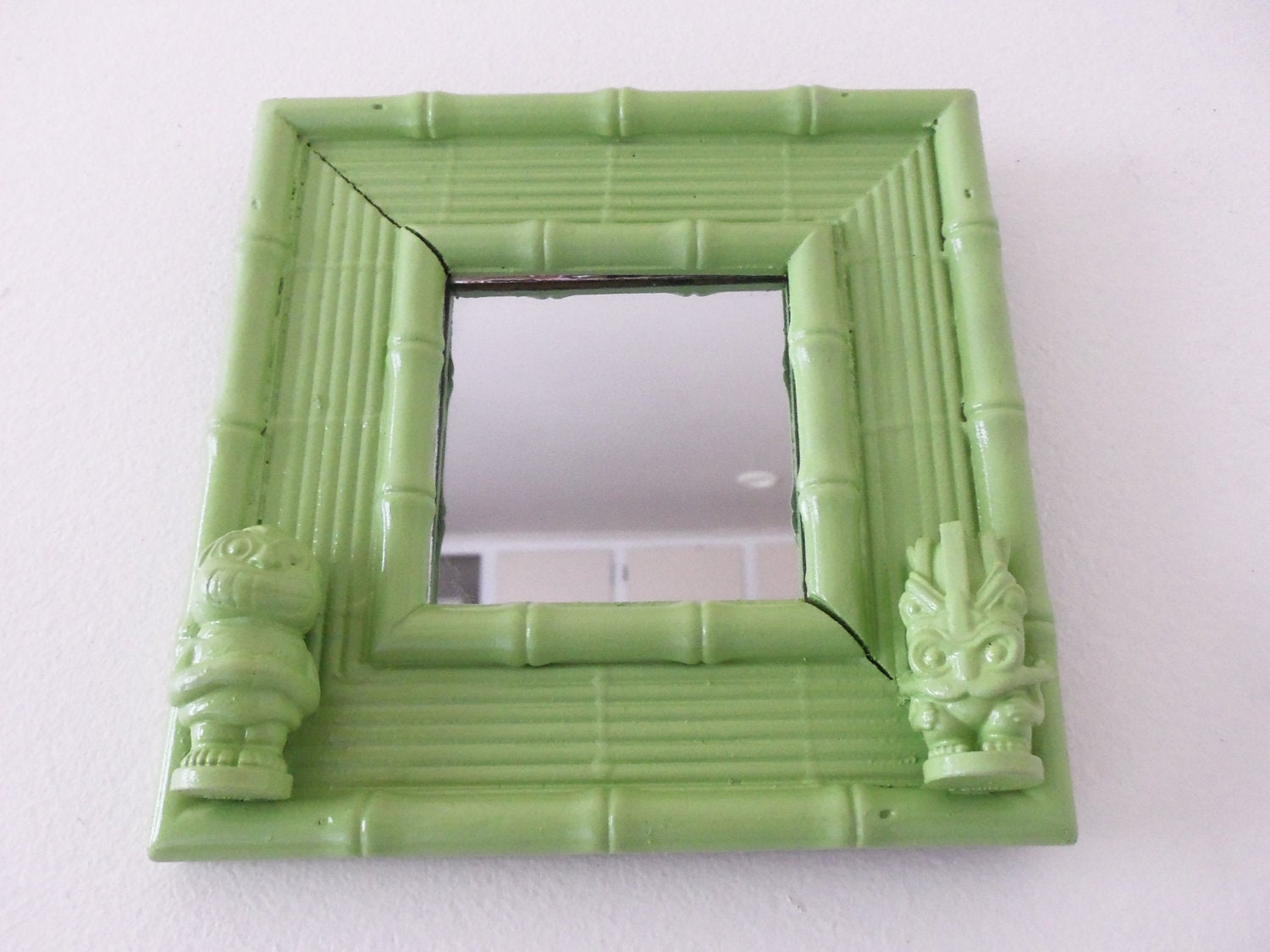 green tiki bamboo mirror