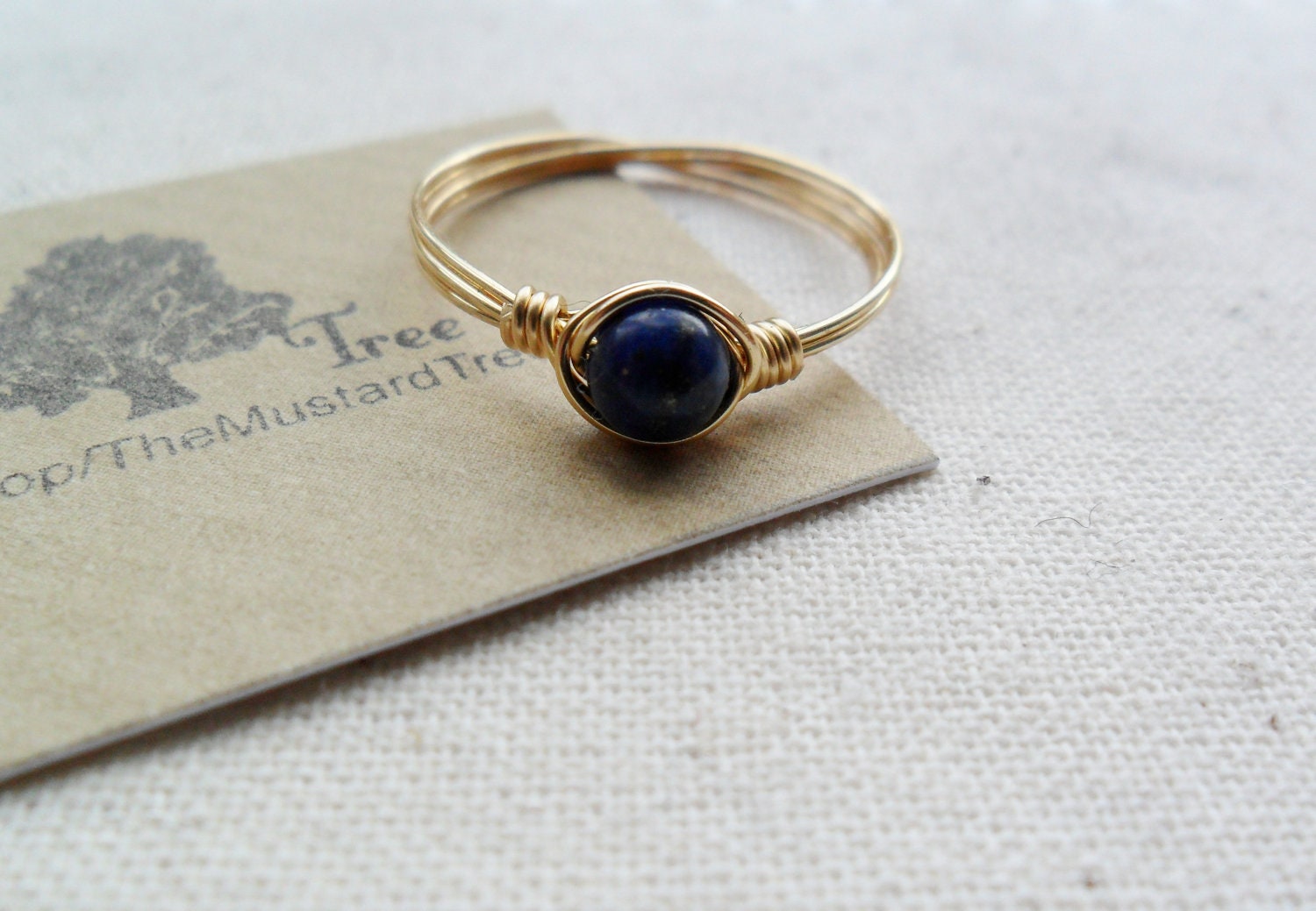 Dark blue lapis lazuli gemstone gold brass wire wrapped ring