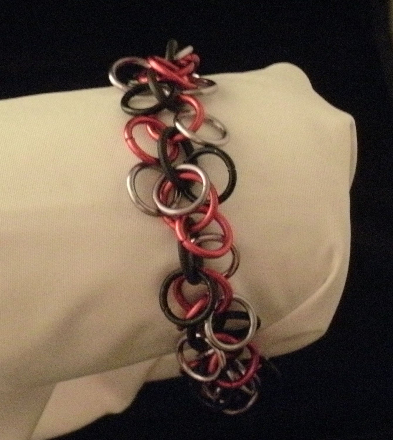 Hanging Bells Bracelet in Red, Black, and Black Ice