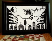 Retro Paper Cut Christmas Village with Santa Sleigh Reindeer Laughing Moon Wall Art