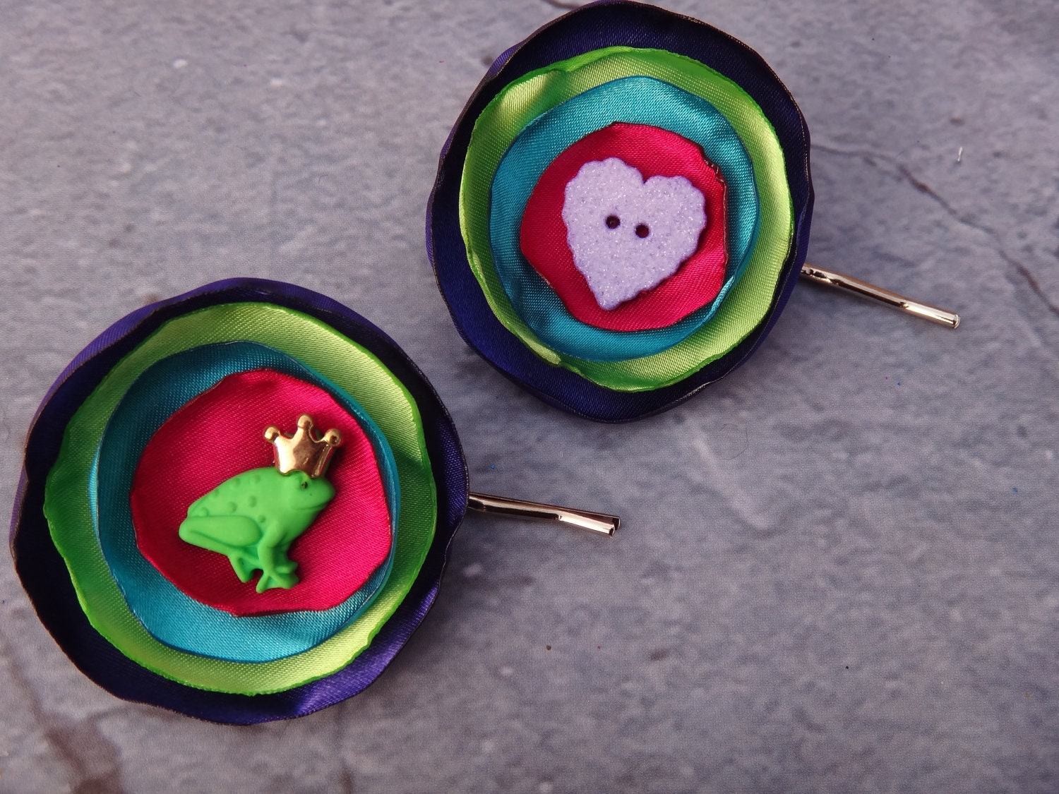 Set of 2 Jewel Tone Satin Flower Bobby Pins with Frog Prince and Heart Accents - AffordableAdorableKC