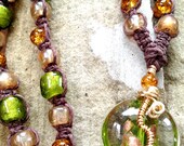 Beaded Hemp Necklace- Luminous Adjustable Length Knotted Hemp Necklace Featuring Amber, Emerald Green, and Gold Crackle Glass Beads