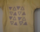 Newborn unisex baby onesie, triangle print on light yellow onesie