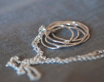Necklace. Sterling silver rings on a belcher chain