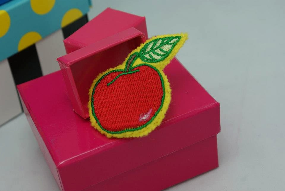 Embroidered, felt, stuffed pin with apple design.  Hand stitched.