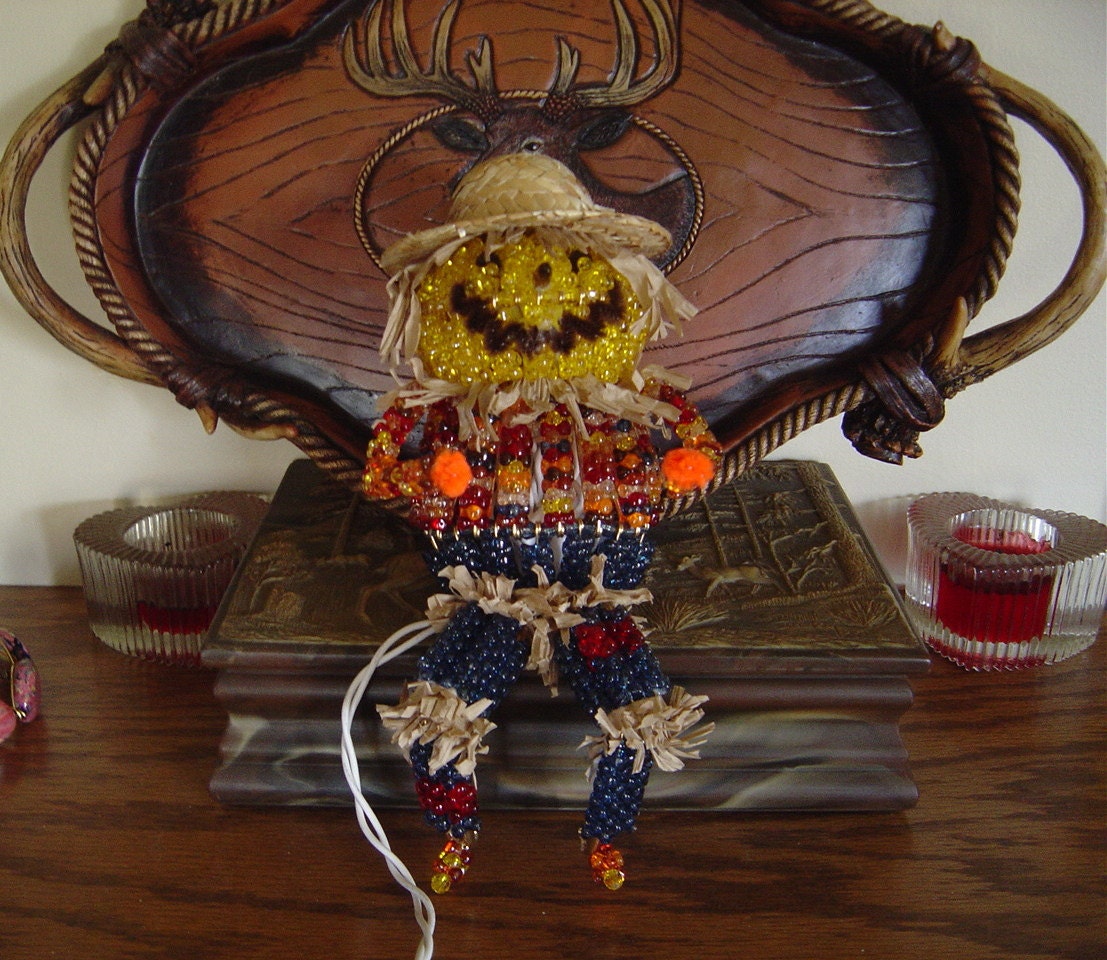 9" Lighted Scarecrow is a Great Holiday Decoration or Center Piece. When lit gives off a wonderful glow Great for Any Holiday Collection