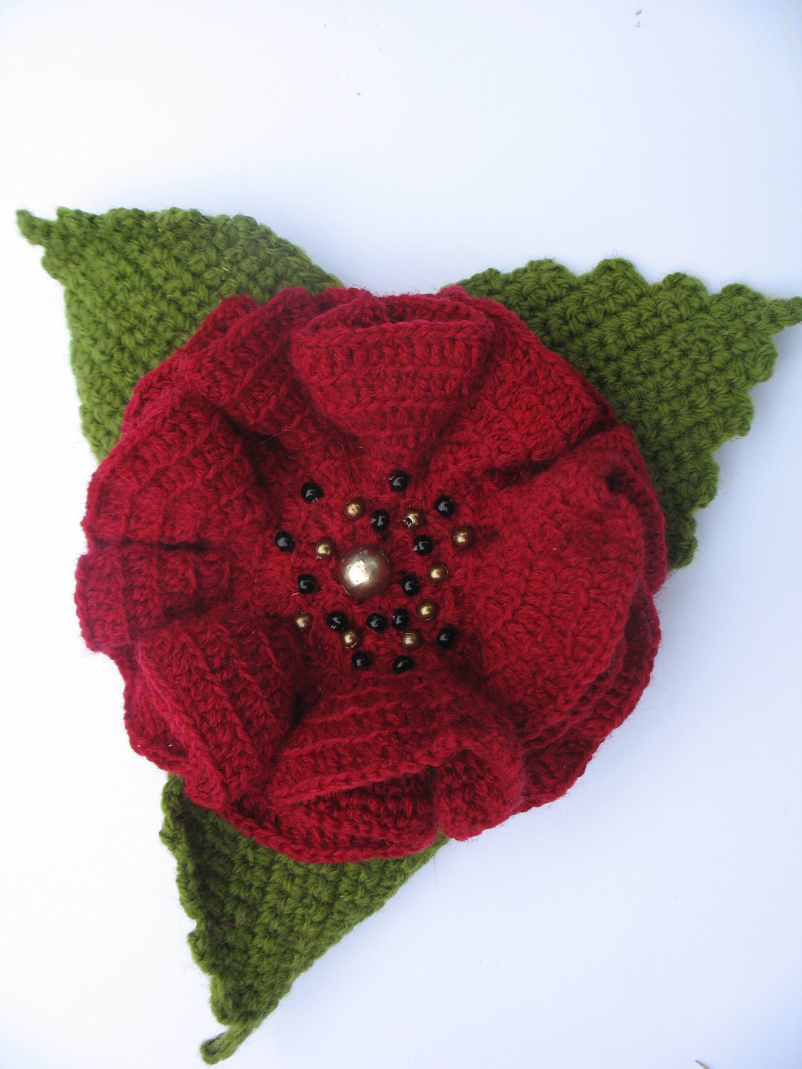 Crochet poppy brooch