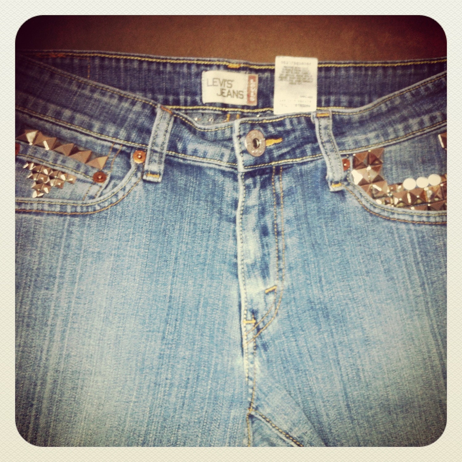 STUDDED and SPIKED Distressed Mid to High Waisted Faded Blue Denim Jean Shorts with Orange Stitching Pink Levis Patch Font Size 9S