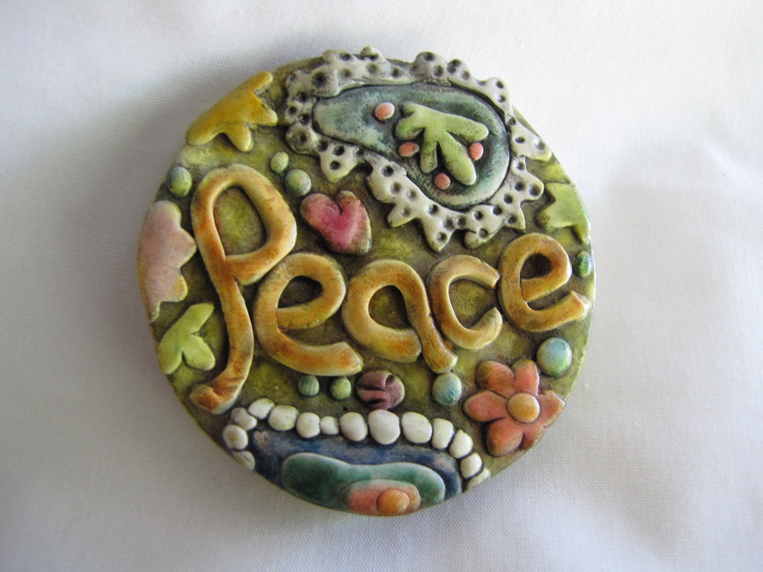 Peace magnet antiqued paisley design polymer clay