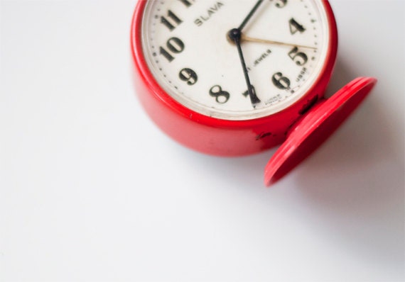 Vintage red mechanical alarm clock "Slava"