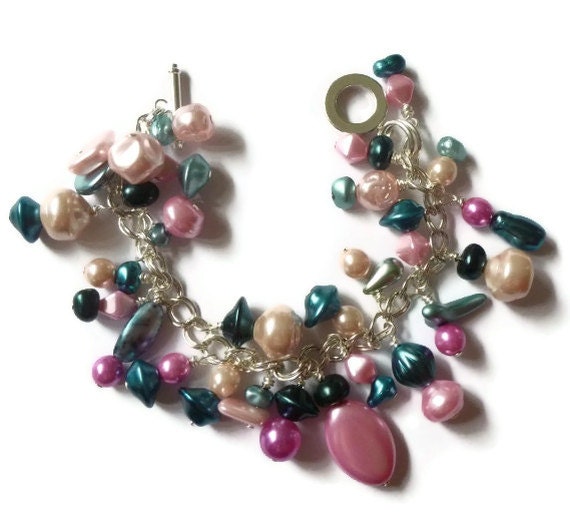 Silver Plated Charm Bracelet with Pink and Greeny Blue Glass Beads in Different Sizes, Shapes and Shades.