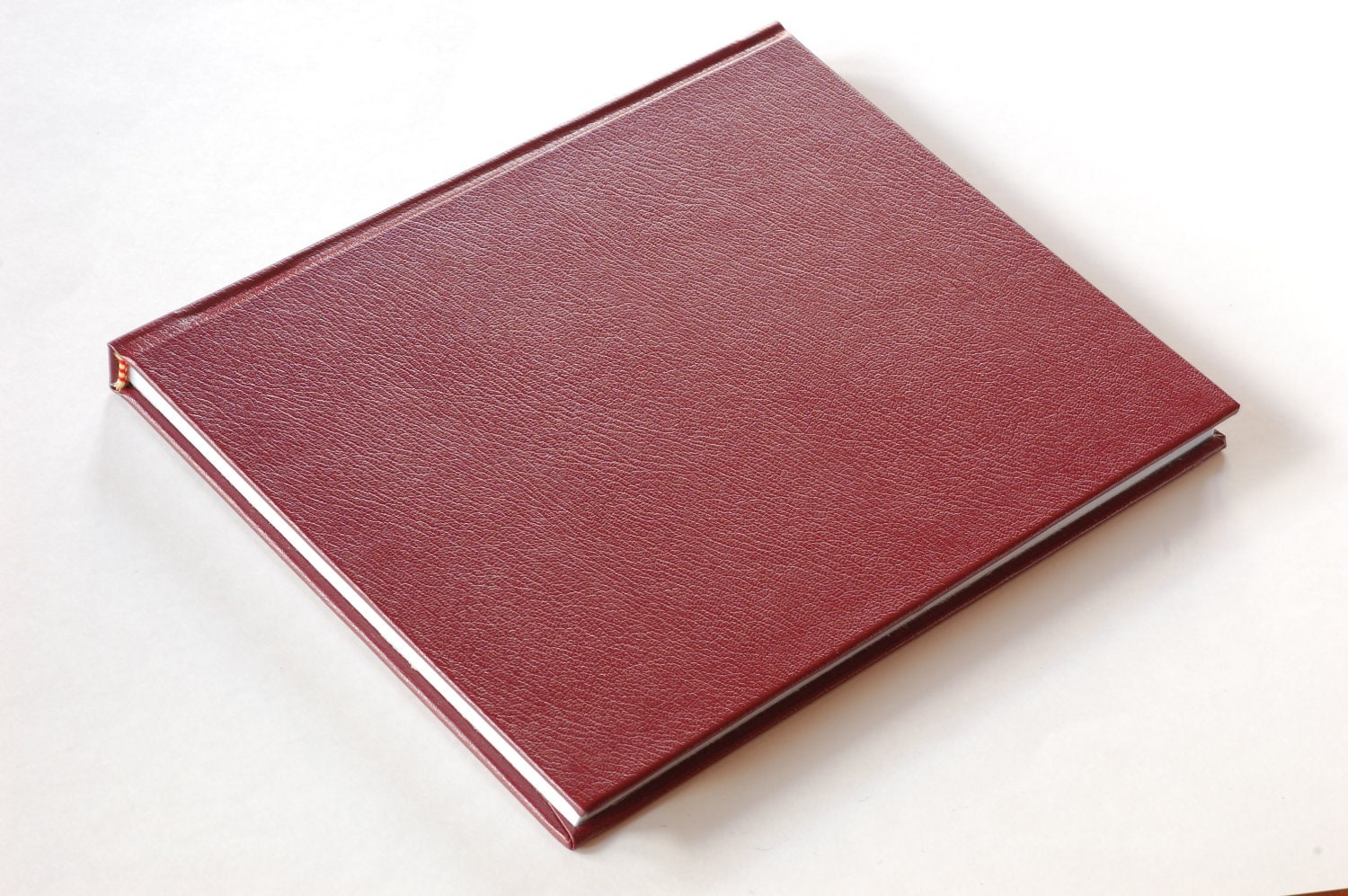 The Gnotebook, a unique iPad case handmade from an engineering notebook, with internal magnets (burgundy leather cover / black interior)