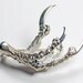 nevermore brooch. high polished sterling silver.