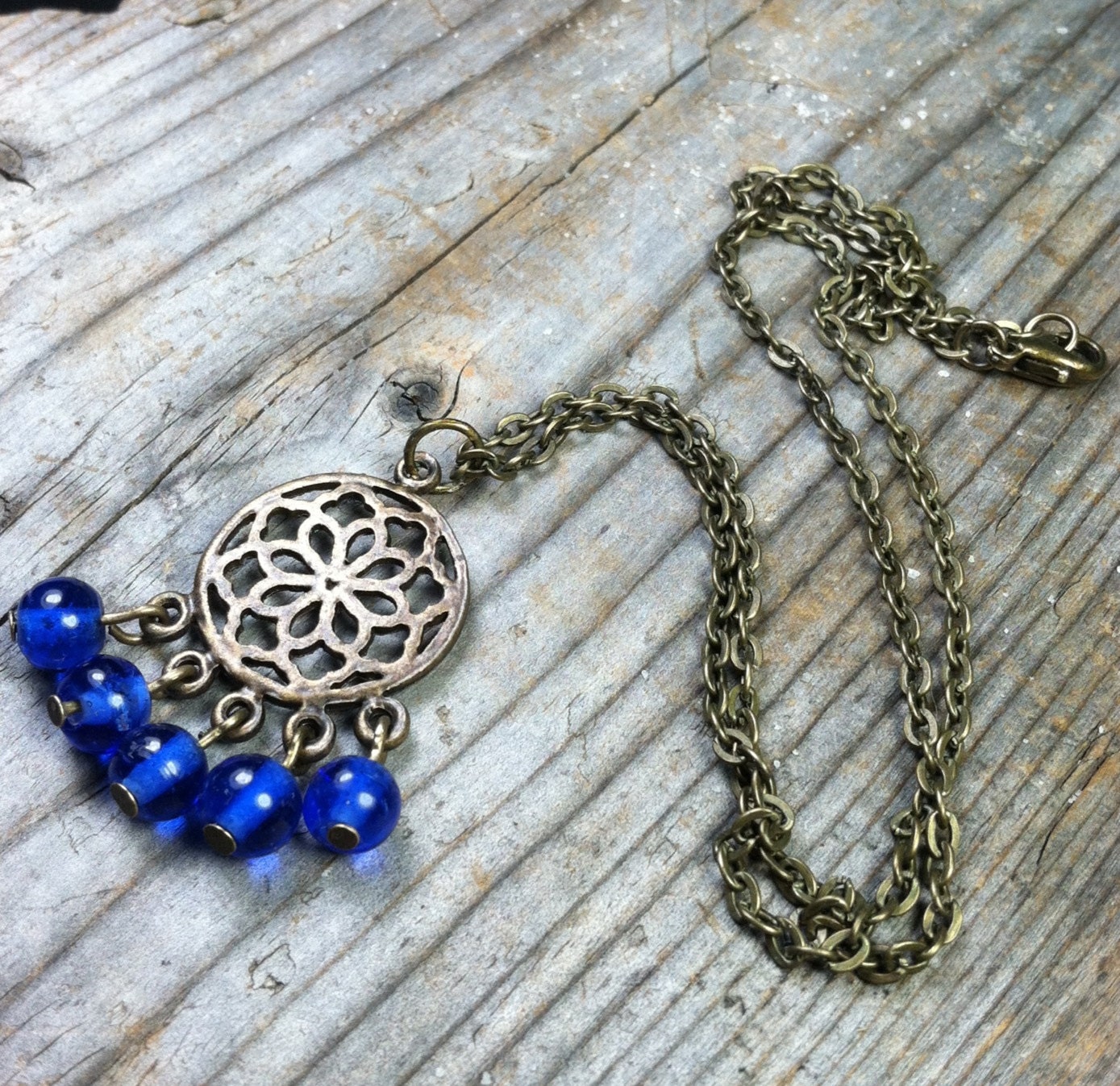 Singing the Blues Necklace - antique brass / gold metal chandelier charm / pendant - cobalt blue glass - chain