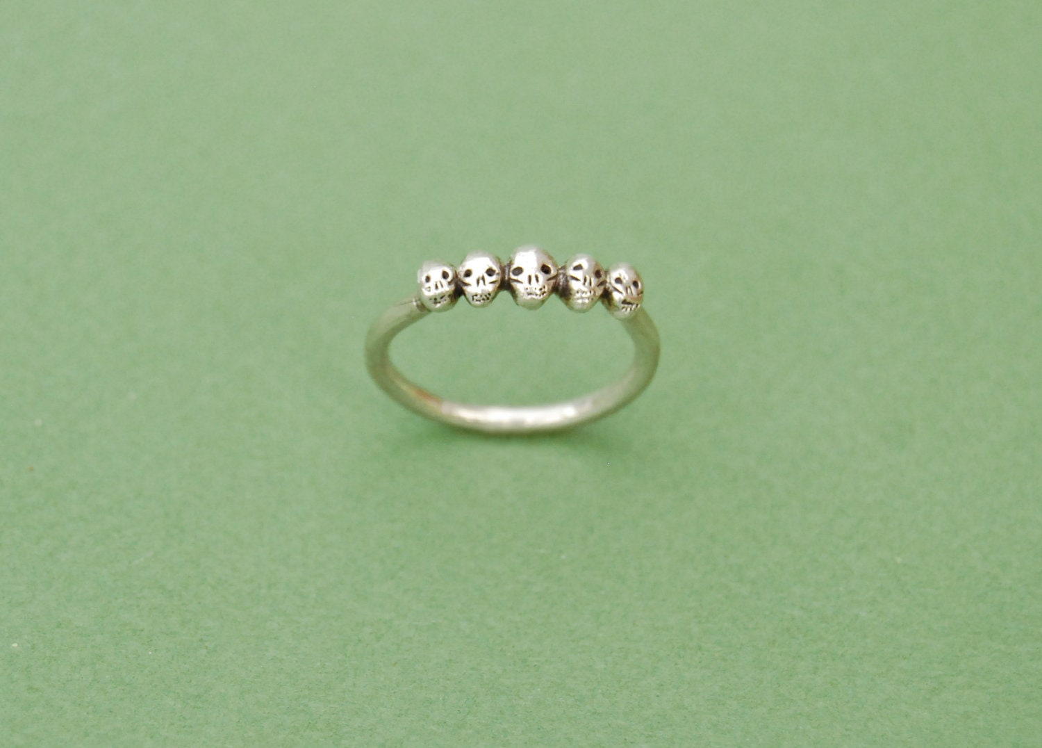 Tiny Skulls silver ring
