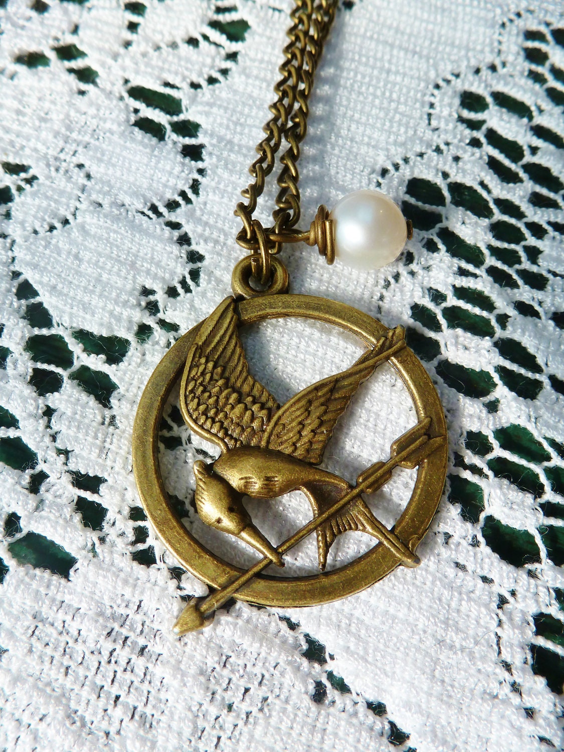 Katniss Mockingjay film replica necklace, with Peetas pearl or red glass heart