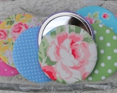 Pocket mirror covered with floral or spotty fabric, with organza gift bag