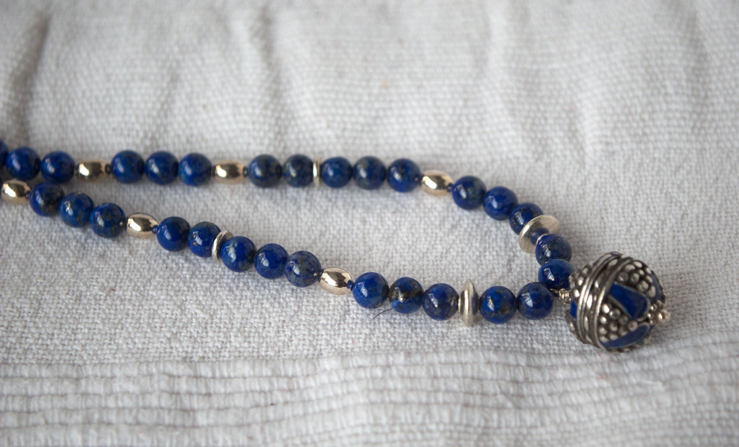 Silver and blue enamel pendant from Morocco with lapis lazuli and silver bead necklace
